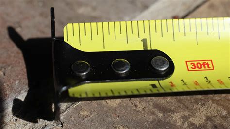 wiggly metal bracket on the end of a tape measure|metal at the end of tape measure.